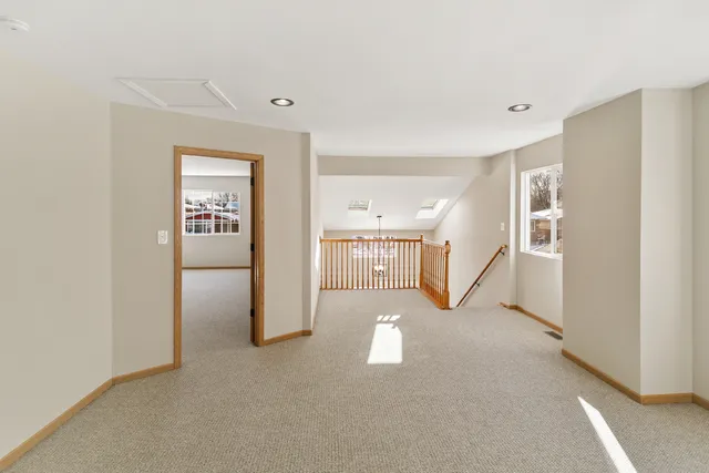 a view of a hallway with staircase