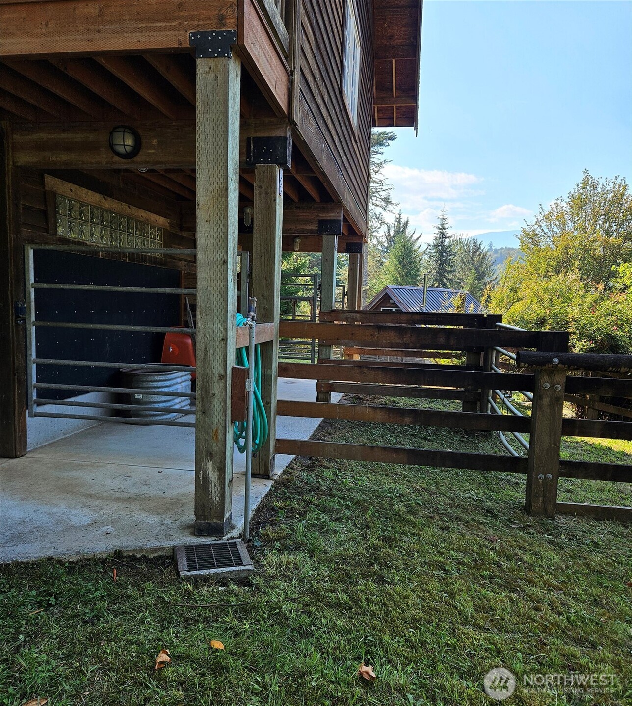 106 Crocker Lake Road Quilcene, WA 98376 - Photo 18 of 38 a view of a entrance gate of the house and front of a house