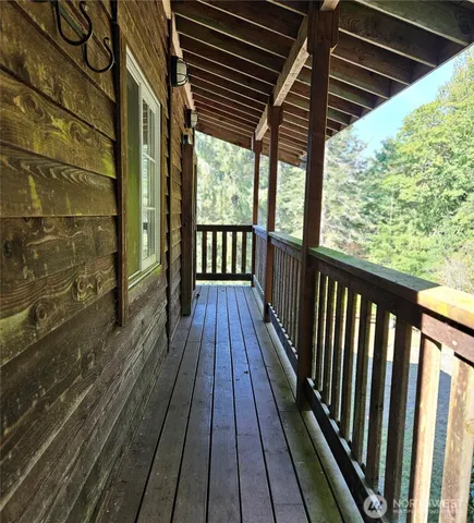 a view of balcony with wooden floor