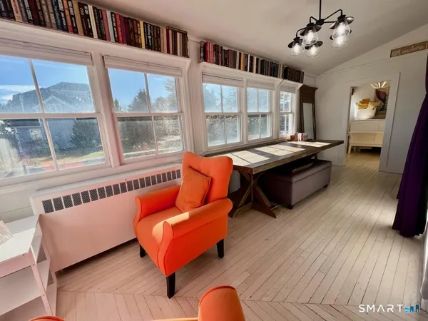 a bed room with a bed and a chair