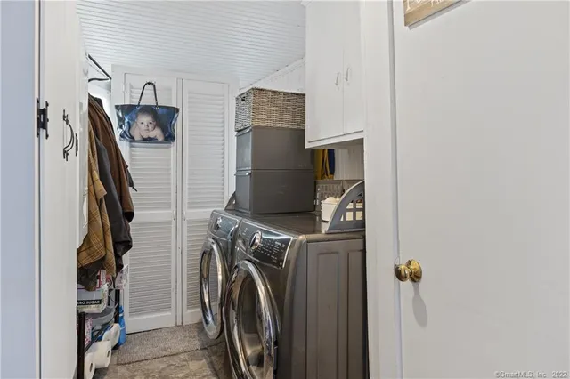 a view of walk in closet with clothes