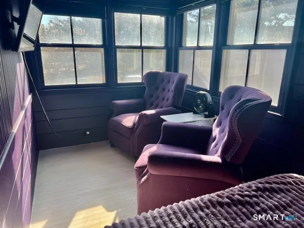 a living room with furniture and a window