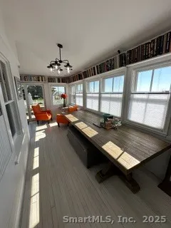 a room with furniture pool table and windows