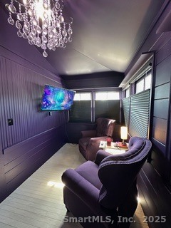 624 Vineyard Point Road Guilford, CT 06437 - Photo 17 of 38 a living room with furniture and a chandelier