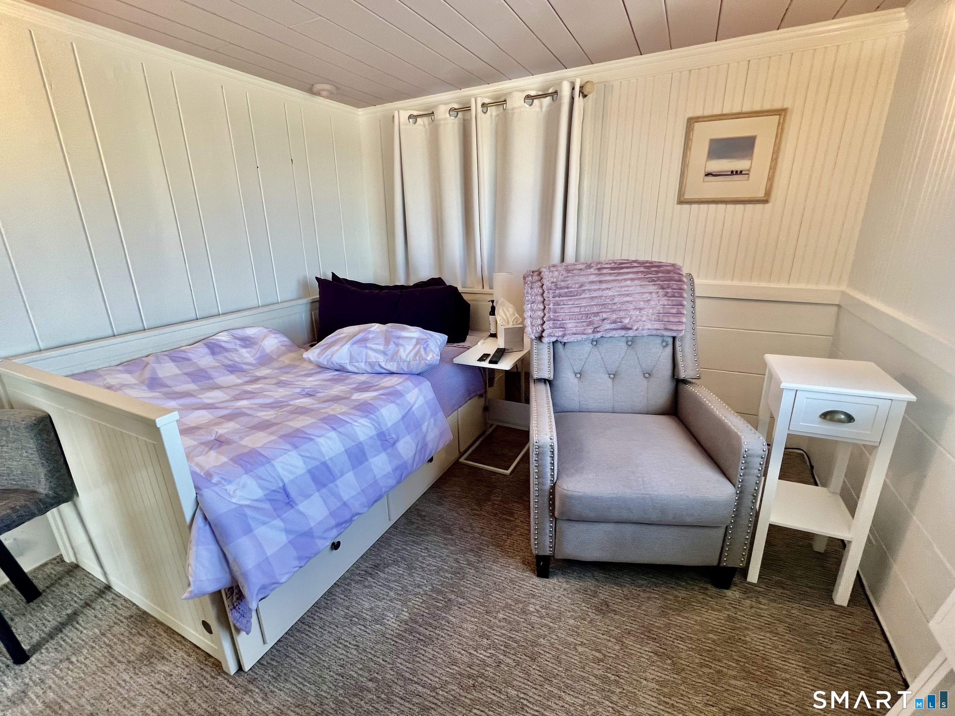 624 Vineyard Point Road Guilford, CT 06437 - Photo 21 of 40 a bedroom with a bed and a mirror