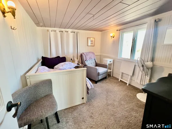 a view of a balcony with wooden floor and outdoor space