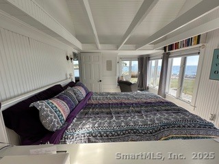 624 Vineyard Point Road Guilford, CT 06437 - Photo 22 of 38 a living room with a couch