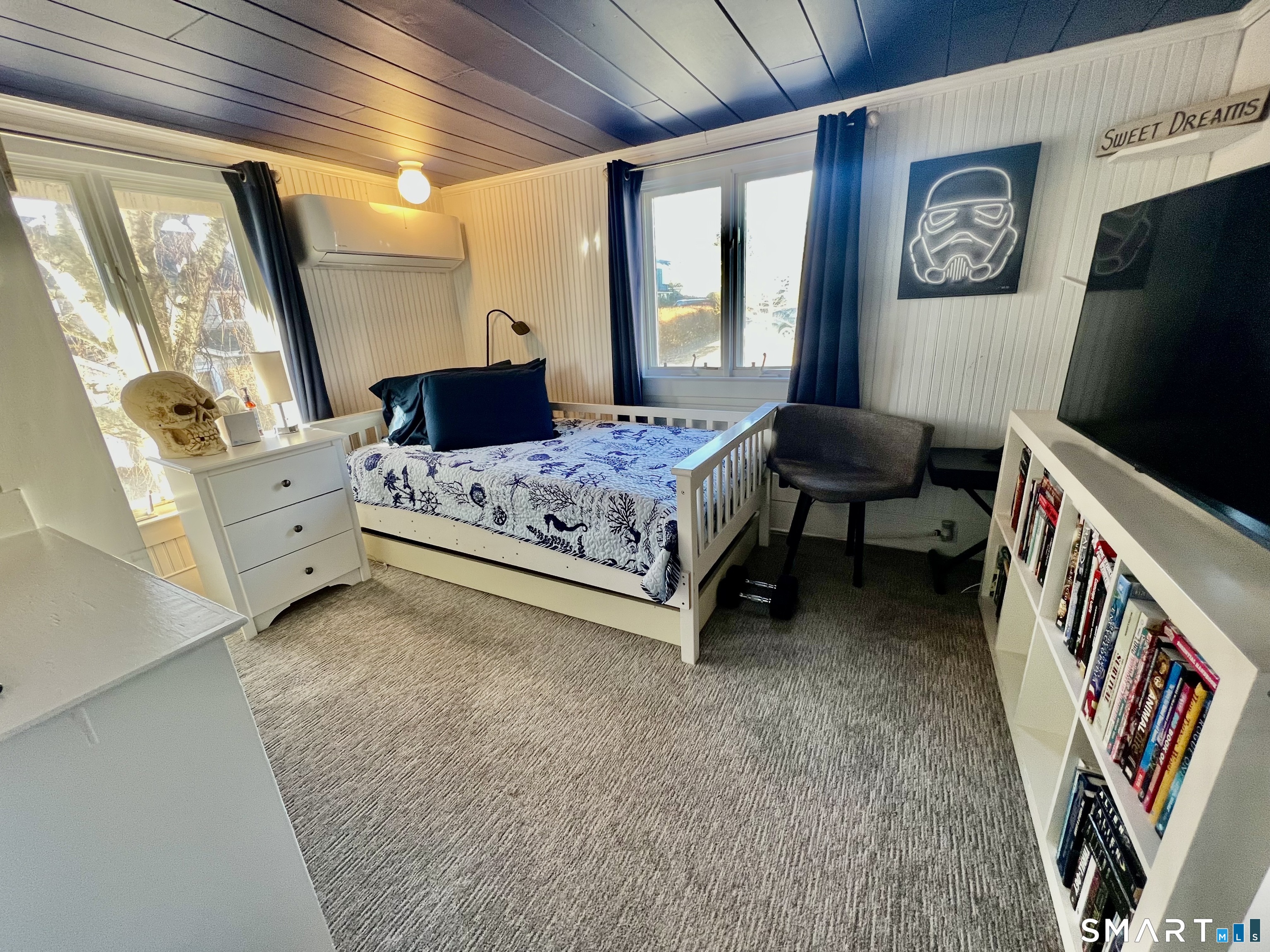 624 Vineyard Point Road Guilford, CT 06437 - Photo 23 of 40 a bedroom with furniture and a flat screen tv