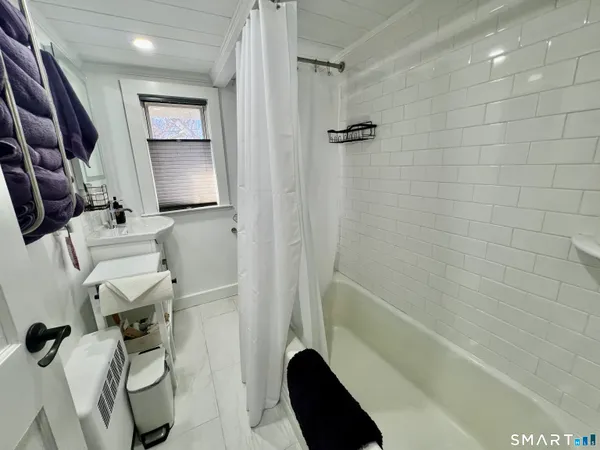 a view of a house with pool and sitting area