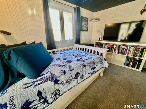 a view of a patio with a table and chairs