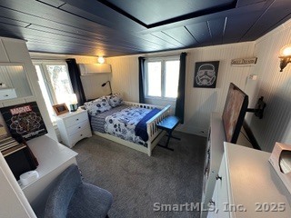 624 Vineyard Point Road Guilford, CT 06437 - Photo 25 of 38 a bedroom with furniture and a window