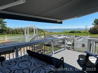 624 Vineyard Point Road Guilford, CT 06437 - Photo 26 of 40 a view of a balcony with wooden floor and outdoor space