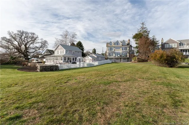 an aerial view of a house with a yard basket ball court and outdoor seating