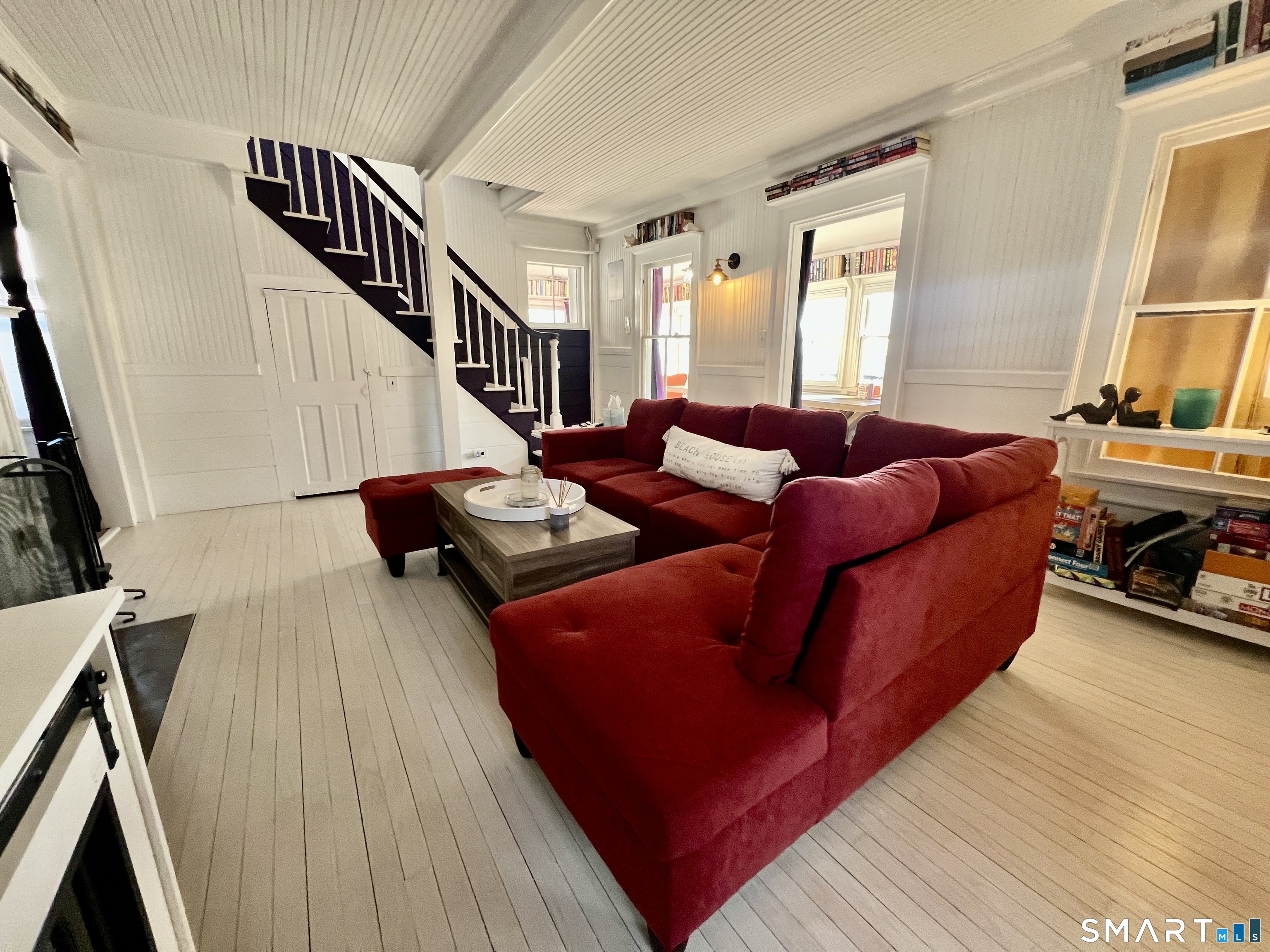 624 Vineyard Point Road Guilford, CT 06437 - Photo 6 of 40 a living room with furniture and a flat screen tv