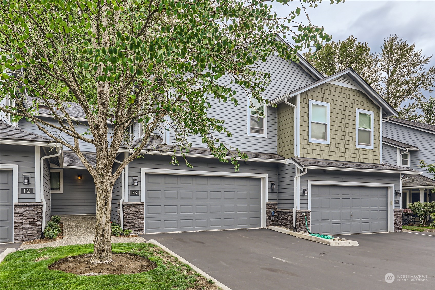 2201 Southeast 192nd, Unit F3 Bothell, WA 98012 - Photo 1 of 15 a front view of a house with a garage