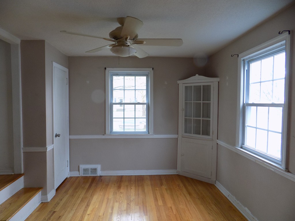 35 Burnside Terrace Springfield, MA 01118 - Photo 3 of 12 wooden floor in an empty room with a window