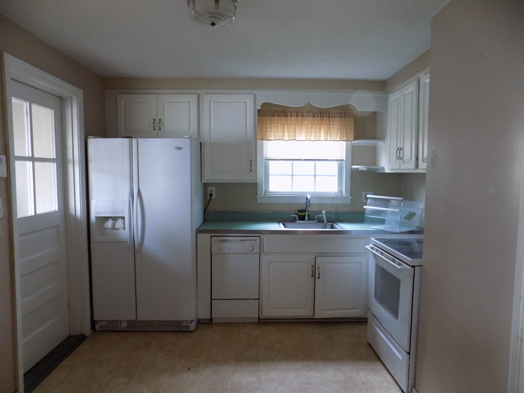35 Burnside Terrace Springfield, MA 01118 - Photo 4 of 12 a kitchen with granite countertop white cabinets and white stainless steel appliances