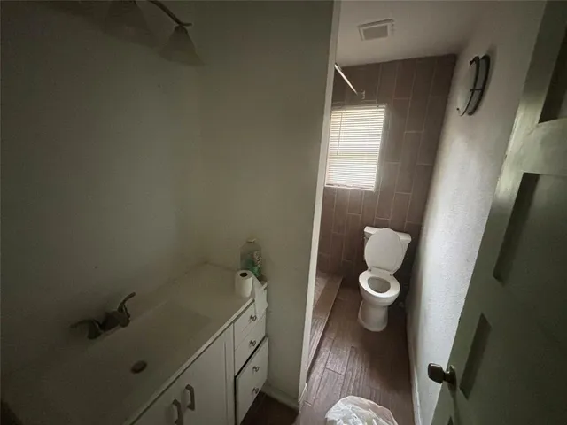 a bathroom with a sink and toilet
