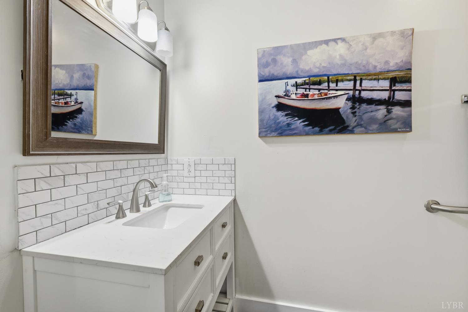 1245 Graves Harbor Trail, Unit 2101 Huddleston, VA 24104 - Photo 16 of 40 a bathroom with a sink and a mirror