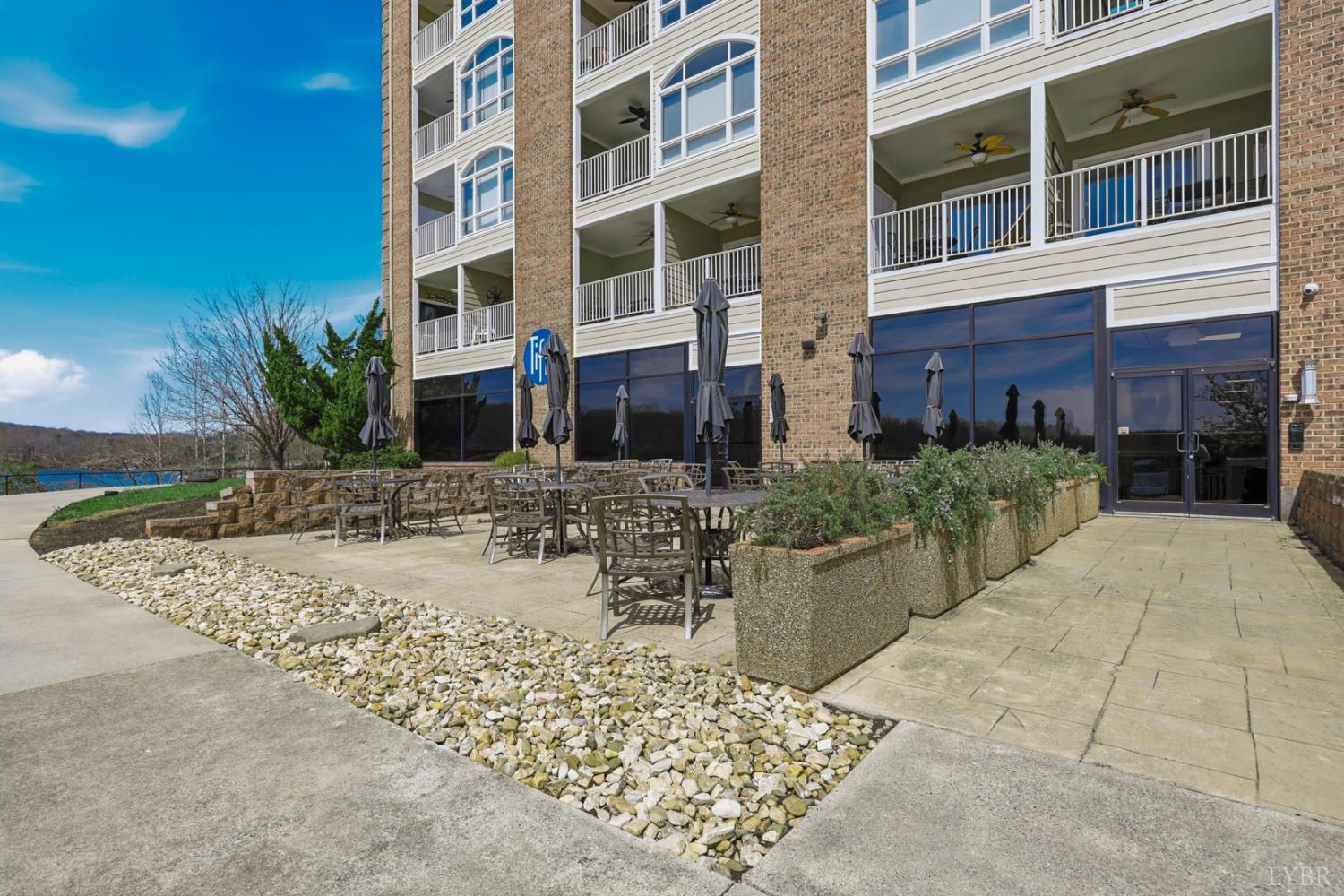 1245 Graves Harbor Trail, Unit 2101 Huddleston, VA 24104 - Photo 30 of 40 a view of a building with a patio