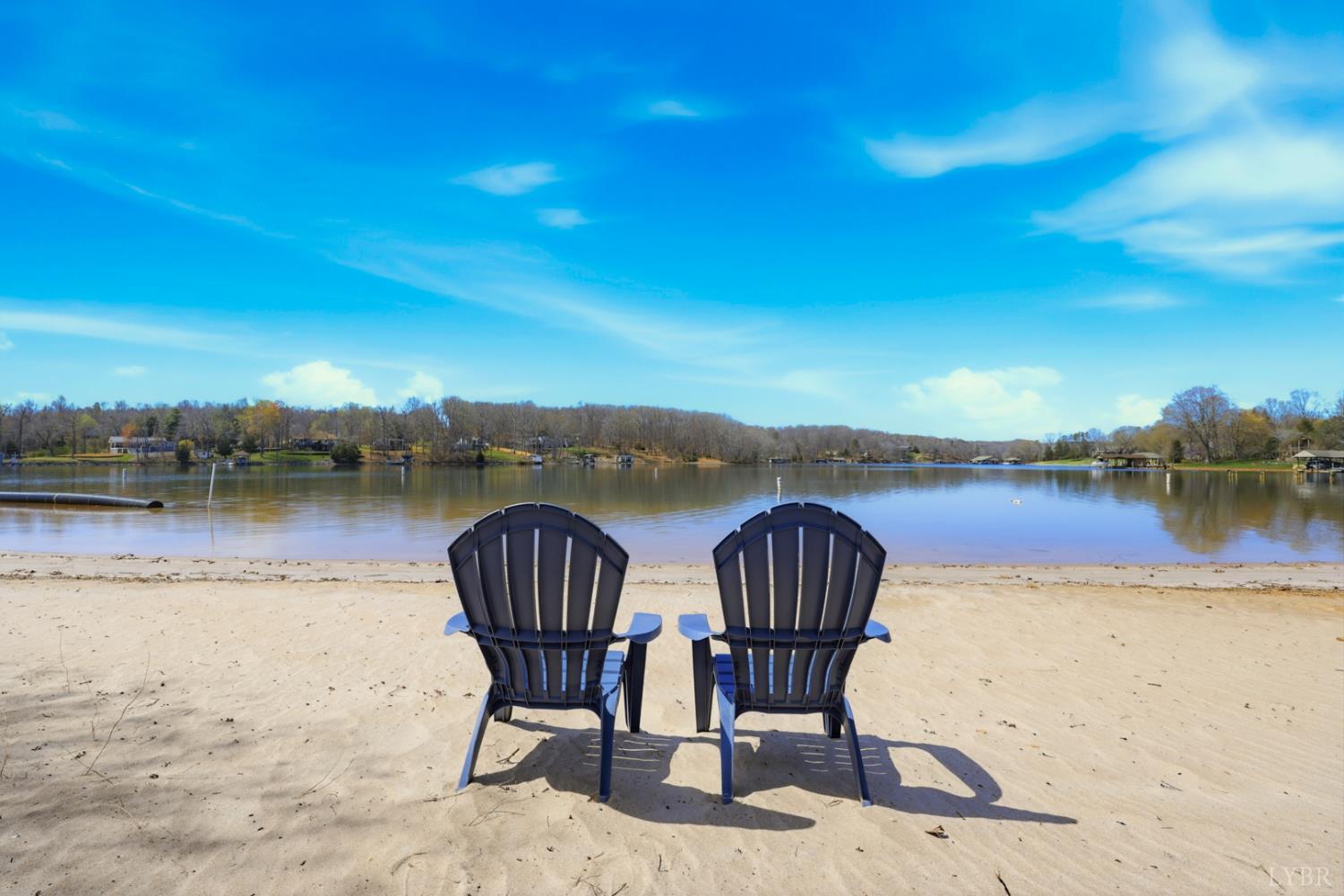 1245 Graves Harbor Trail, Unit 2101 Huddleston, VA 24104 - Photo 33 of 40 a view of a lake with table and chairs