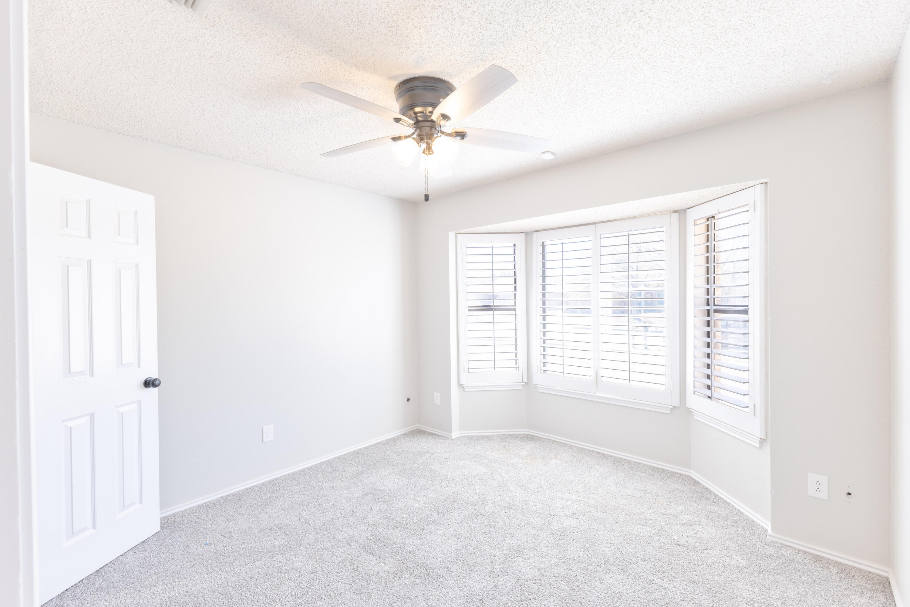 6036 71st Street Lubbock, TX 79424 - Photo 11 of 15 a view of an empty room with a window