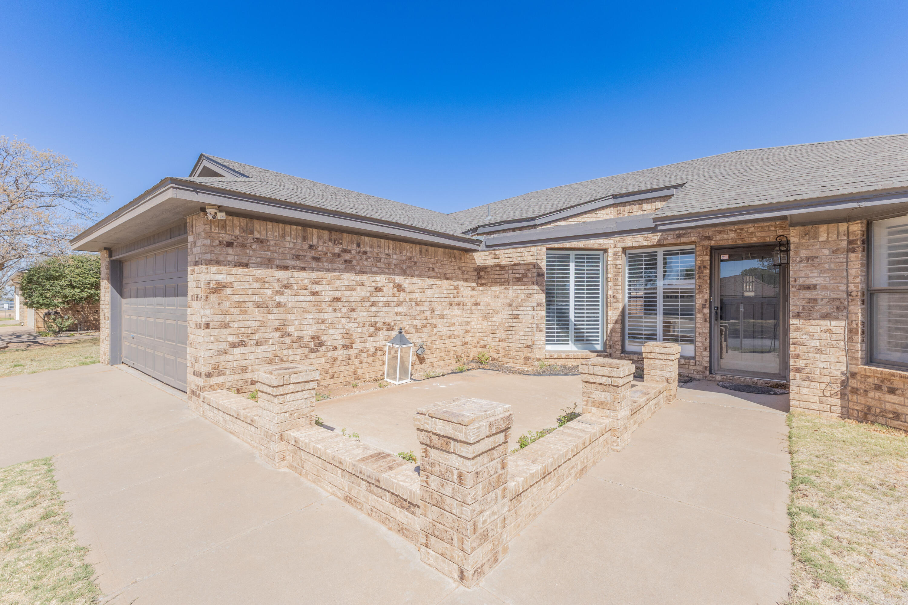 6036 71st Street Lubbock, TX 79424 - Photo 2 of 15 a spacious bathroom with a bathtub and shower