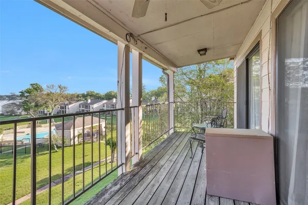 a view of a balcony with lake view and a ocean view