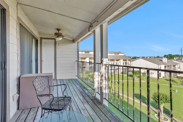 a view of balcony with furniture