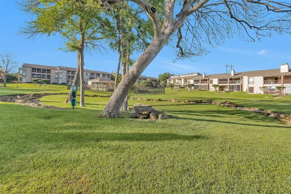 a view of an ocean and building in a yard