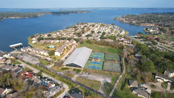 an aerial view of residential houses with outdoor space