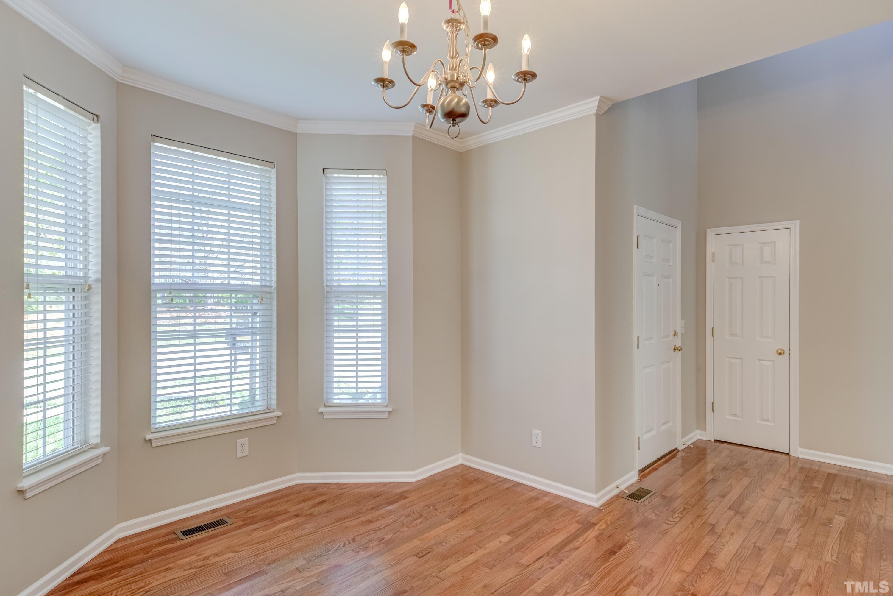 2408 Spruce Shadows Lane Raleigh, NC 27614 - Photo 10 of 40 a view of an empty room with a window
