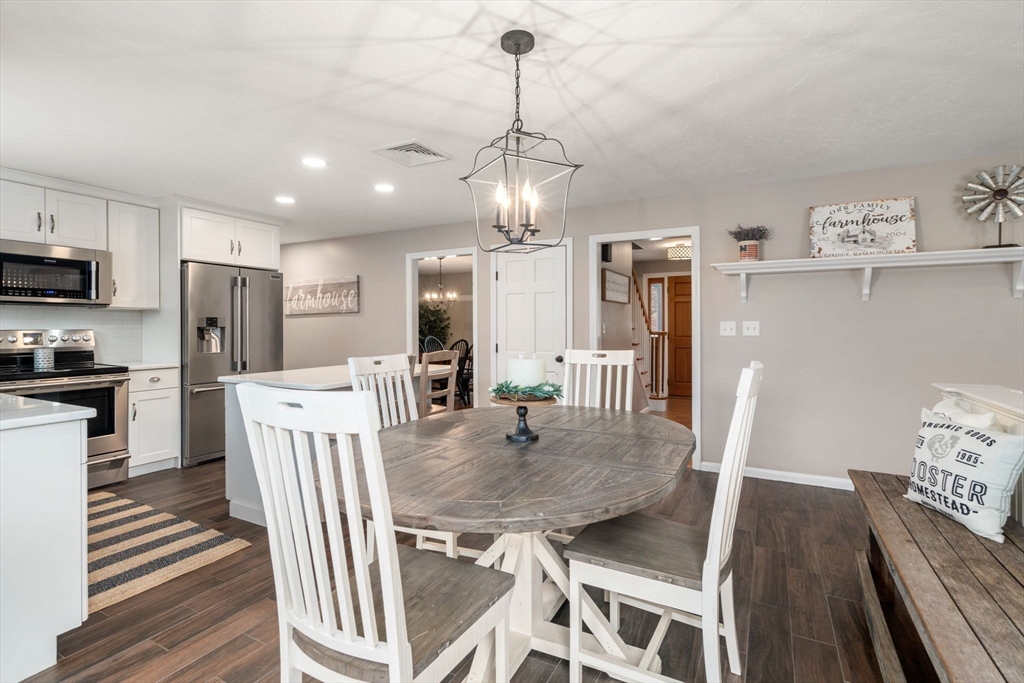 51 Albee Road Uxbridge, MA 01569 - Photo 13 of 42 a view of a dining room with furniture wooden floor and chandelier