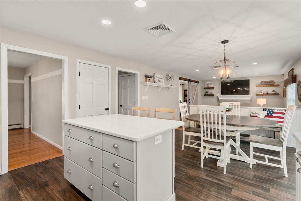51 Albee Road Uxbridge, MA 01569 - Photo 16 of 42 a kitchen that has a table and chairs in it