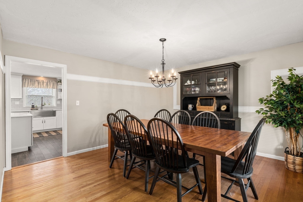 51 Albee Road Uxbridge, MA 01569 - Photo 17 of 42 a view of a dining room with furniture and wooden floor