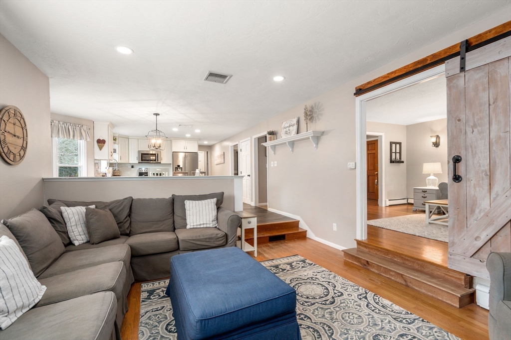 51 Albee Road Uxbridge, MA 01569 - Photo 22 of 42 a living room with furniture and a rug