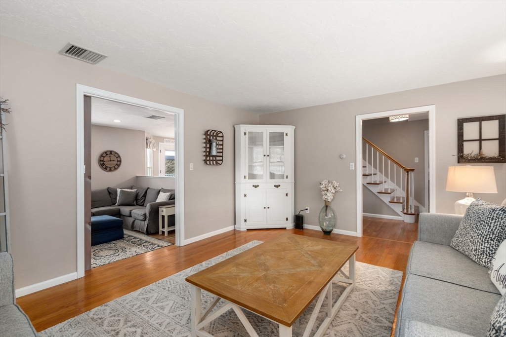 51 Albee Road Uxbridge, MA 01569 - Photo 23 of 42 a living room with furniture and a wooden floor