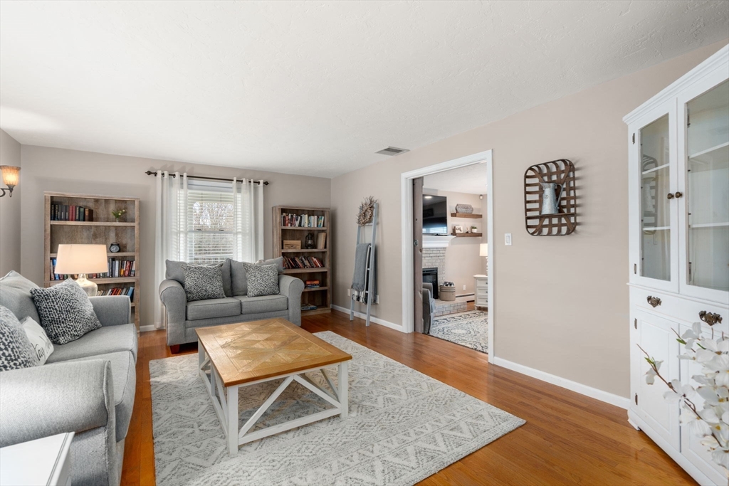 51 Albee Road Uxbridge, MA 01569 - Photo 24 of 42 a living room with furniture and wooden floor