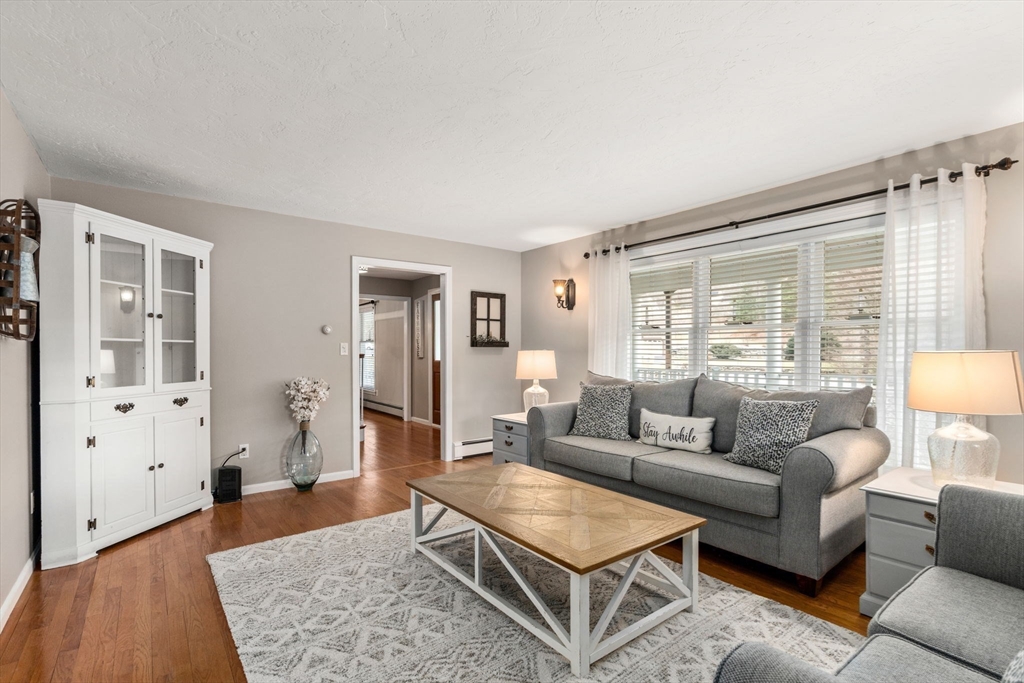 51 Albee Road Uxbridge, MA 01569 - Photo 25 of 42 a living room with furniture and wooden floor