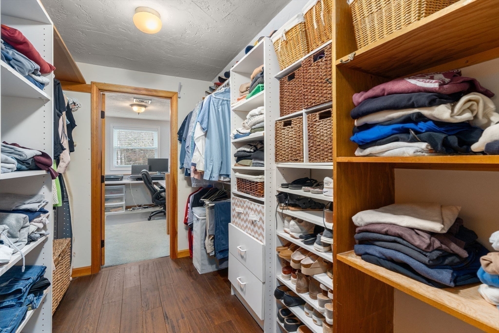 51 Albee Road Uxbridge, MA 01569 - Photo 32 of 42 a view of walk in closet with clothes and shoes