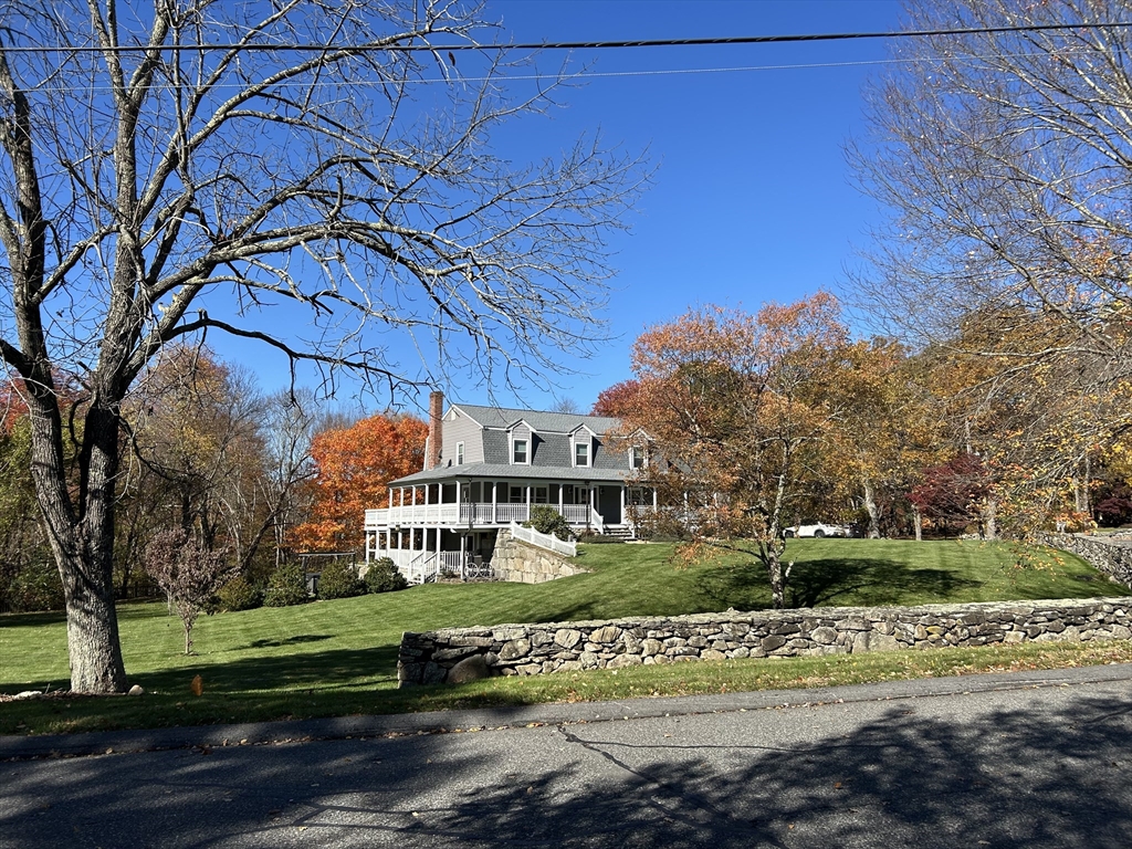 51 Albee Road Uxbridge, MA 01569 - Photo 4 of 42 a view of a building with a yard