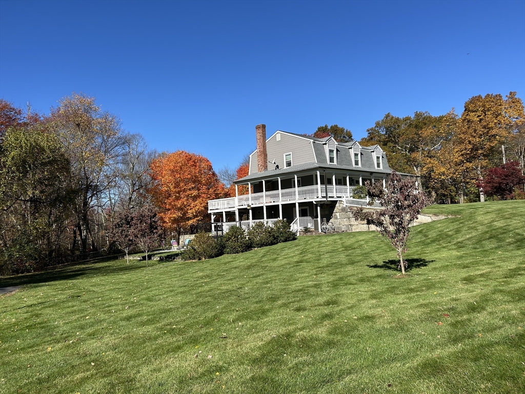 51 Albee Road Uxbridge, MA 01569 - Photo 7 of 42 a view of a house with a yard