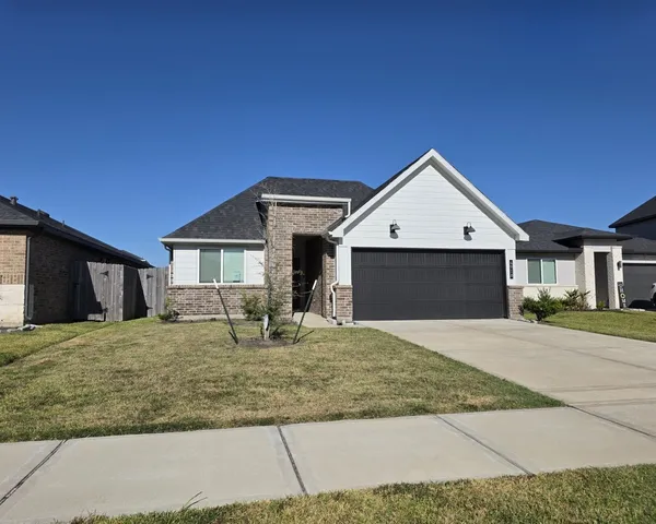 a front view of a house with yard