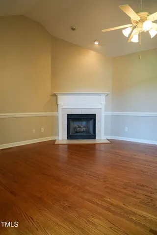 a kitchen with kitchen island a large window a sink and cabinets