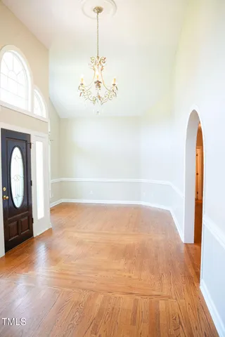 a bathroom with a vanity a mirror and a bathtub