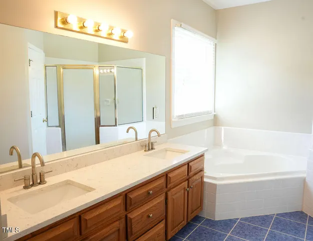 a bathroom with a bathtub sink and toilet