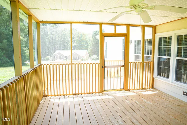 a front view of a house with wooden floor and door