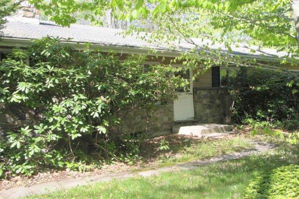 1156 Pine Tree Road Tobyhanna, PA 18466 - Photo 1 of 4 a backyard of a house with yard and outdoor seating
