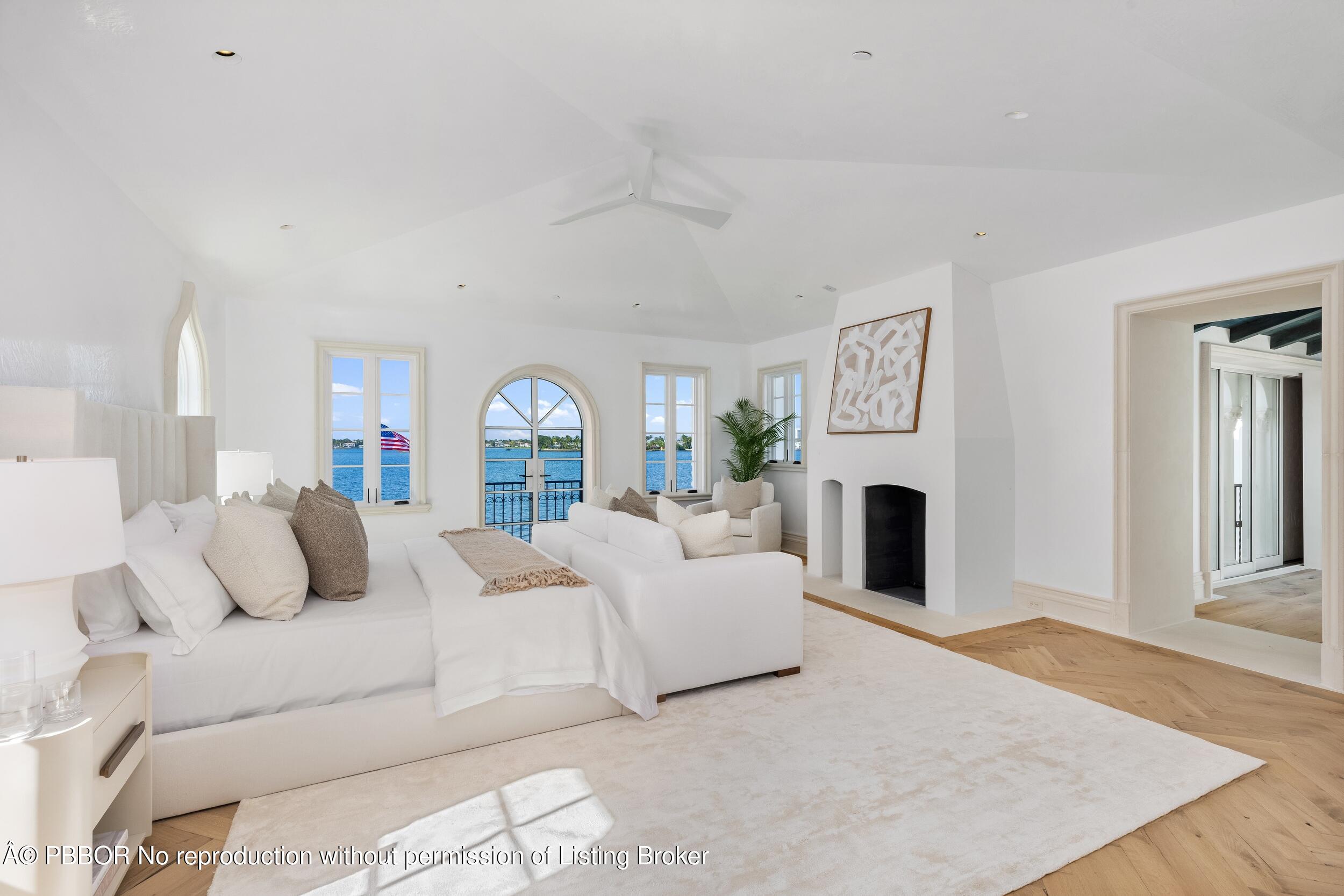 800 South County Road Palm Beach, FL 33480 - Photo 51 of 76 a bedroom with furniture and a fireplace