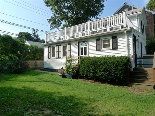 323 Appleton Street Arlington, MA 02476 - Photo 1 of 9 a front view of a house with garden